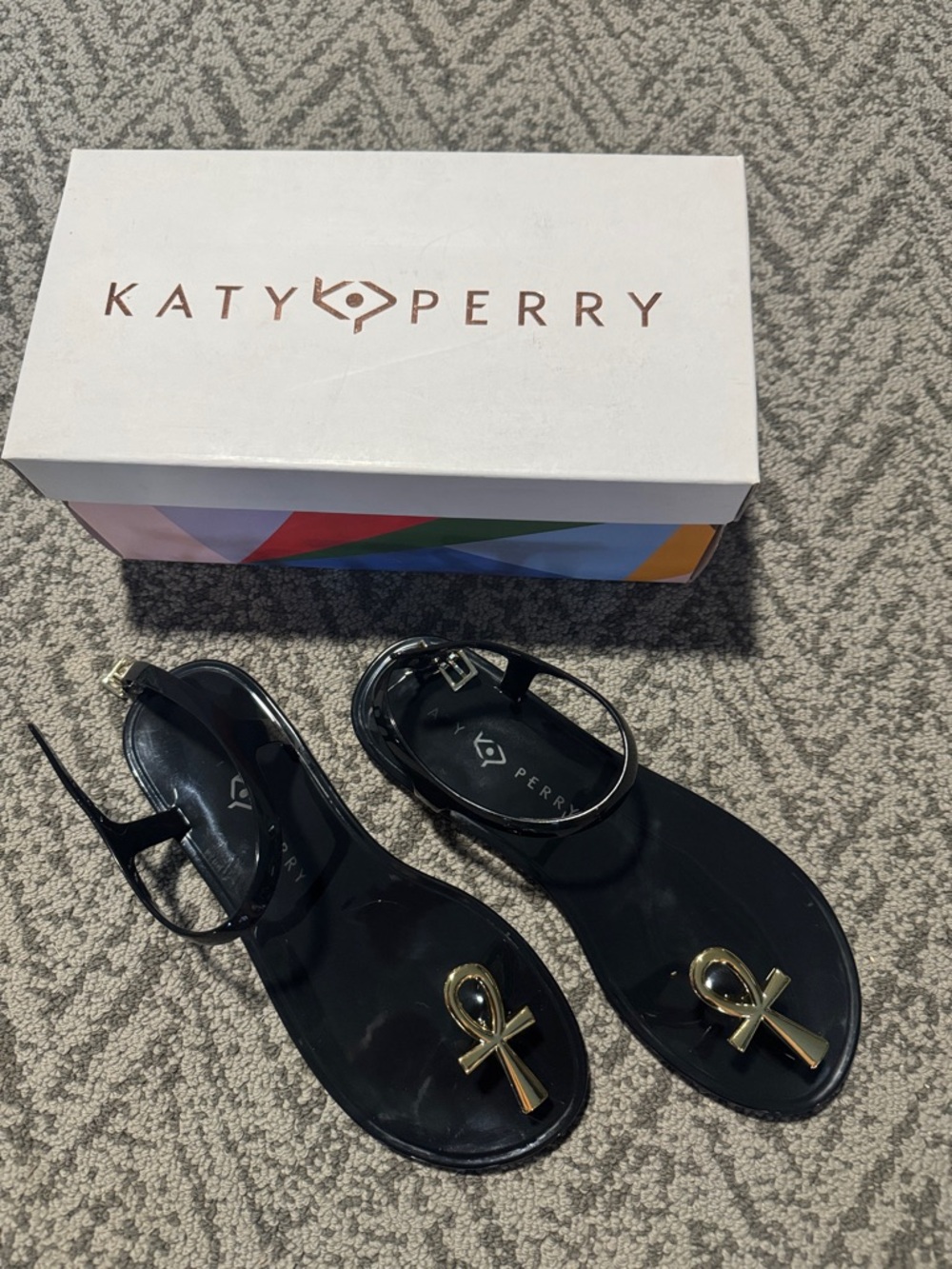 Katy Perry Collections Black Jelly Sandals with Gold Ankh Accent